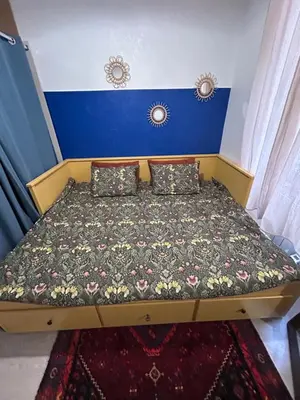 Un ou plusieurs lits dans un hébergement de l'établissement YOUSRA Appartement
