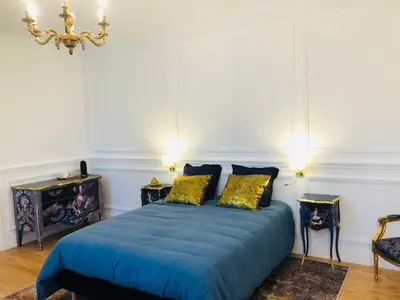 Un ou plusieurs lits dans un hébergement de l'établissement L'Hôtel Particulier du 12