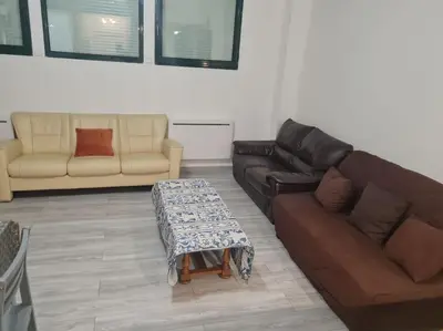 Coin salon dans l'établissement Le BEAU SEJOUR