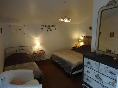 Un ou plusieurs lits dans un hébergement de l'établissement Gîte de la Villa André