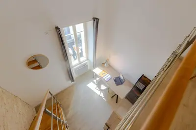 Un ou plusieurs lits dans un hébergement de l'établissement Maison Élégante avec Jardin I Centre de Cognac