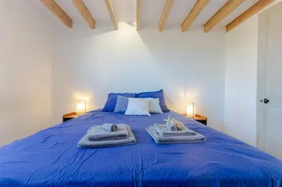Un ou plusieurs lits dans un hébergement de l'établissement Maison Élégante avec Jardin I Centre de Cognac