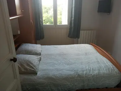 Un ou plusieurs lits dans un hébergement de l'établissement Gîte Le Sequoia