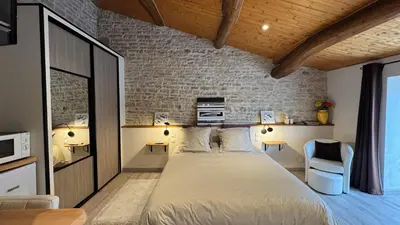 Un ou plusieurs lits dans un hébergement de l'établissement Chambres d'hôtes Les Rozières