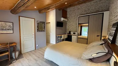Un ou plusieurs lits dans un hébergement de l'établissement Chambres d'hôtes Les Rozières