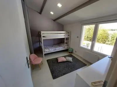 Un ou plusieurs lits dans un hébergement de l'établissement Gîte Ô Pallinois Proche Futuroscope de Poitiers