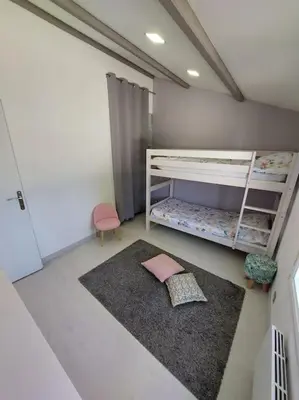 Un ou plusieurs lits dans un hébergement de l'établissement Gîte Ô Pallinois Proche Futuroscope de Poitiers