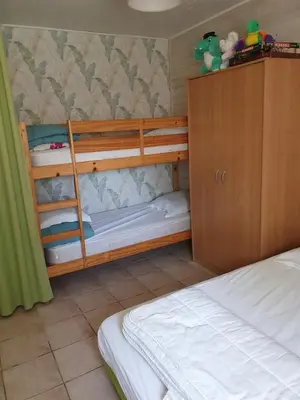 Un ou plusieurs lits dans un hébergement de l'établissement La petite maison