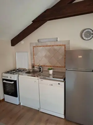 Cuisine ou kitchenette dans l'établissement Fermette à 10 mn du Futuroscope