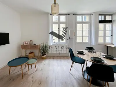 Télévision ou salle de divertissement dans l'établissement L'Escale d'Audry - Appartement sur cour situé en plein coeur de ville
