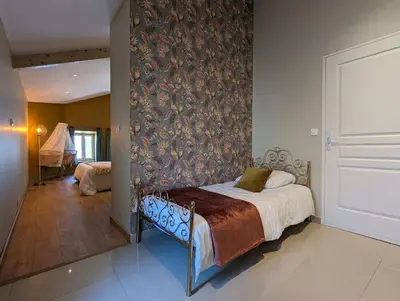 Un ou plusieurs lits dans un hébergement de l'établissement LA VINCELLA Gîte de charme , proche d'Angoulême, 3 chambres