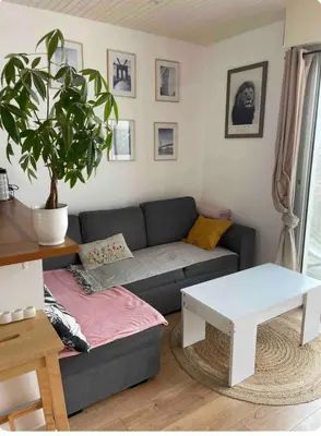 Coin salon dans l'établissement Charmante maison de ville avec terasse intime