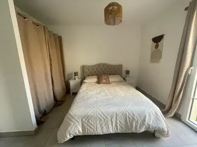 Un ou plusieurs lits dans un hébergement de l'établissement Charmante maison neuve