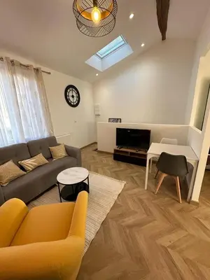 Coin salon dans l'établissement Appart cosy - belle vue
