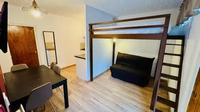 Un ou plusieurs lits dans un hébergement de l'établissement Studio Cosy