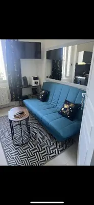 Coin salon dans l'établissement Appartement cosy proche gare