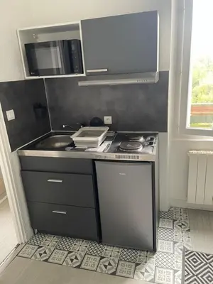 Cuisine ou kitchenette dans l'établissement Appartement cosy proche gare