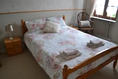 Un ou plusieurs lits dans un hébergement de l'établissement Les Bruyeres B&B 2