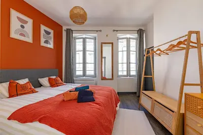 Un ou plusieurs lits dans un hébergement de l'établissement Maisonnette au cœur de Cognac