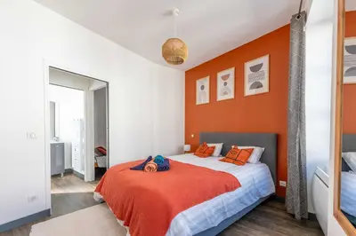 Un ou plusieurs lits dans un hébergement de l'établissement Maisonnette au cœur de Cognac