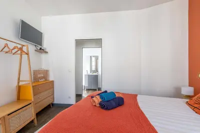 Un ou plusieurs lits dans un hébergement de l'établissement Maisonnette au cœur de Cognac
