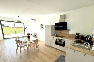 Cuisine ou kitchenette dans l'établissement Les Gites des jardins d'Oscar l'Appartement