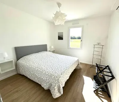 Un ou plusieurs lits dans un hébergement de l'établissement Les Gites des jardins d'Oscar l'Appartement