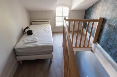 Un ou plusieurs lits dans un hébergement de l'établissement Le Petit Verger, cosy 5 people