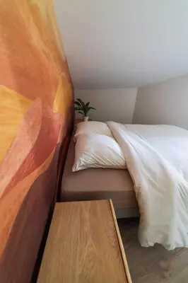 Un ou plusieurs lits dans un hébergement de l'établissement Le Petit Verger, cosy 5 people