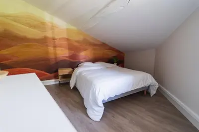 Un ou plusieurs lits dans un hébergement de l'établissement Le Petit Verger, cosy 5 people