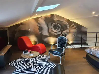 Coin salon dans l'établissement Love room avec spa privatif