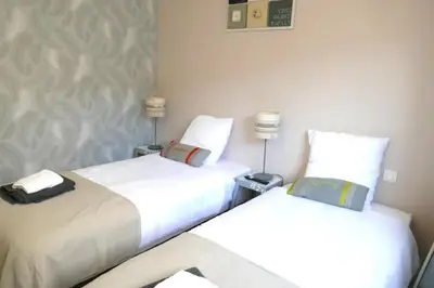 Un ou plusieurs lits dans un hébergement de l'établissement Chambre dhôtes familiale à Saint Pierre du Chemin