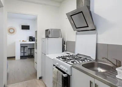 Cuisine ou kitchenette dans l'établissement LE COSY T1 - 18 m2