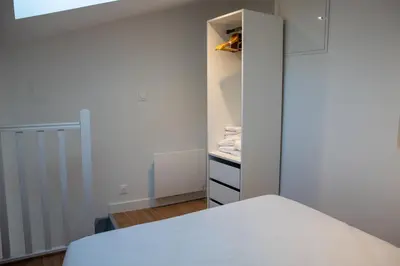 Un ou plusieurs lits dans un hébergement de l'établissement L'Amsterdam - Duplex trés calme au dernier étage