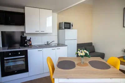 Cuisine ou kitchenette dans l'établissement L'Amsterdam - Duplex trés calme au dernier étage