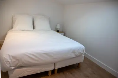 Un ou plusieurs lits dans un hébergement de l'établissement L'Amsterdam - Duplex trés calme au dernier étage