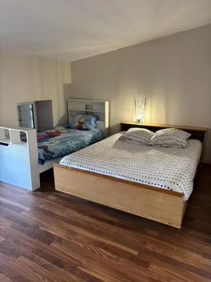 Un ou plusieurs lits dans un hébergement de l'établissement Appartement pour 5 à 7 personnes