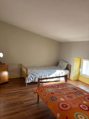 Un ou plusieurs lits dans un hébergement de l'établissement Appartement pour 5 à 7 personnes