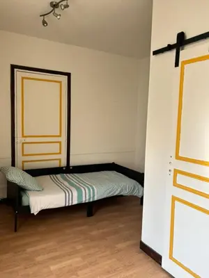 Un ou plusieurs lits dans un hébergement de l'établissement Appartement pour 5 à 7 personnes