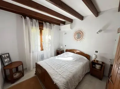 Un ou plusieurs lits dans un hébergement de l'établissement Maison Périgourdine 14 personnes avec piscine