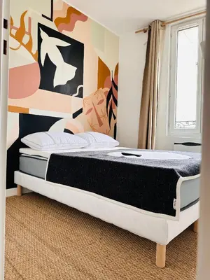 Un ou plusieurs lits dans un hébergement de l'établissement Bel Appartement Duck, Centre, Sèvres