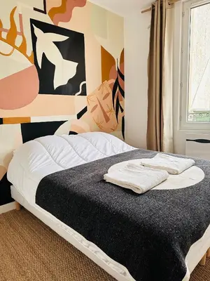 Un ou plusieurs lits dans un hébergement de l'établissement Bel Appartement Duck, Centre, Sèvres