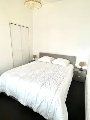 Un ou plusieurs lits dans un hébergement de l'établissement Appartement calme avec exterieur