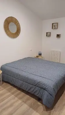 Un ou plusieurs lits dans un hébergement de l'établissement Maison calme au bord de l'eau