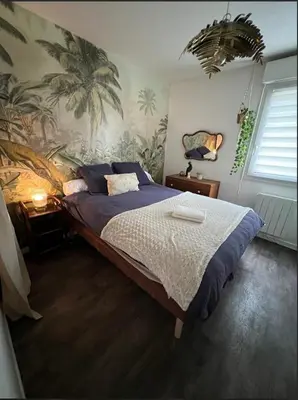 Un ou plusieurs lits dans un hébergement de l'établissement Paisible appartement proche futuroscope