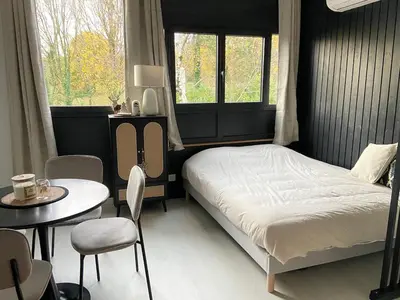 Un ou plusieurs lits dans un hébergement de l'établissement Nouveau Studio Oasis
