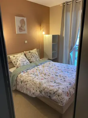 Un ou plusieurs lits dans un hébergement de l'établissement T2 appartement vue sur port
