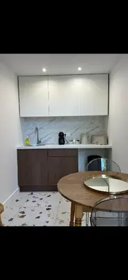 Cuisine ou kitchenette dans l'établissement La Maison du Jardin