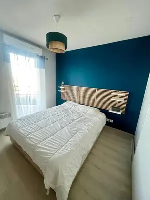 Un ou plusieurs lits dans un hébergement de l'établissement Le Corsaire - Appartement spacieux avec terrasse