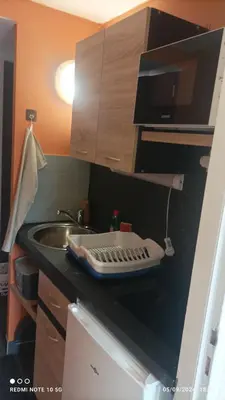Cuisine ou kitchenette dans l'établissement Lolft 3 PROCHE FUTUROSCOPE
